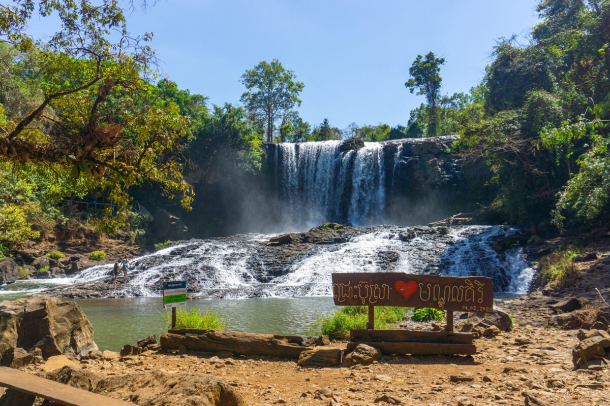 Tropical Bousra Waterfall in Cambodia's wilderness, showcasing the natural beauty near rural Cambodian villages