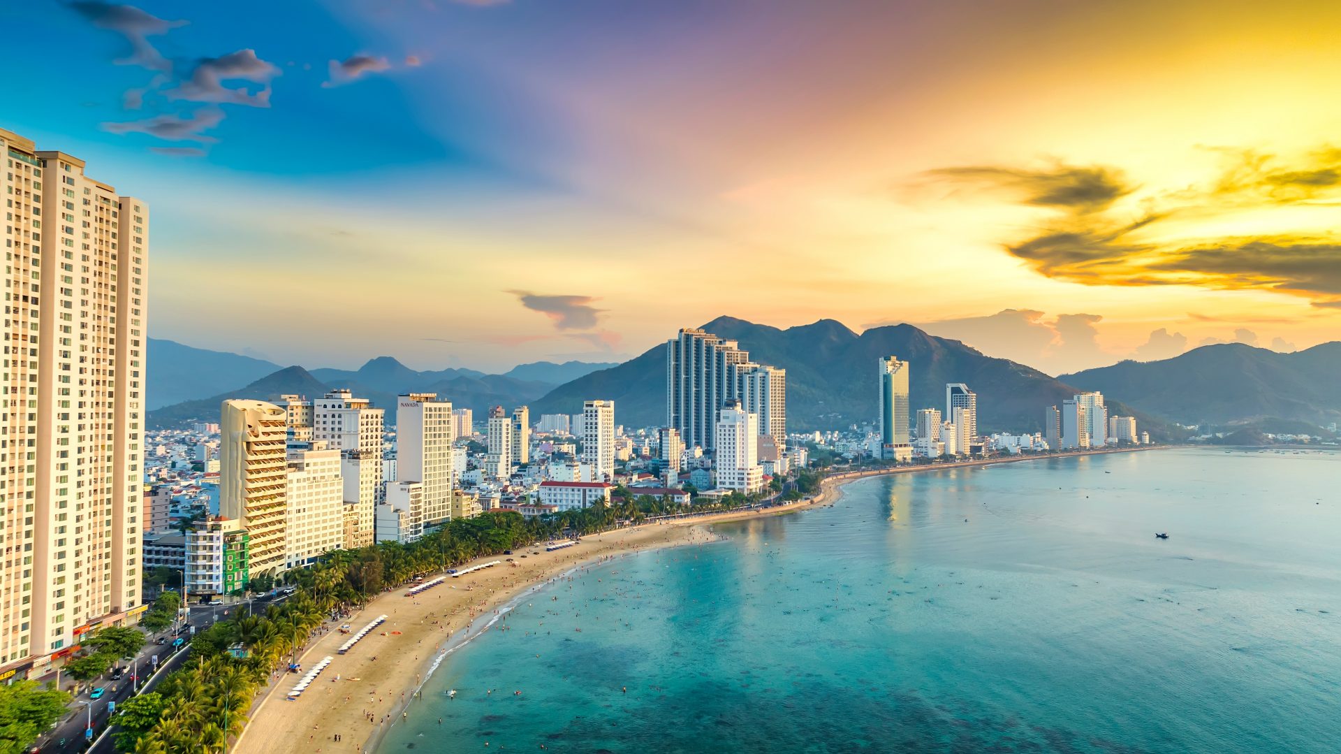 Da Nang coastline with city skyline and beach at sunset in Vietnam