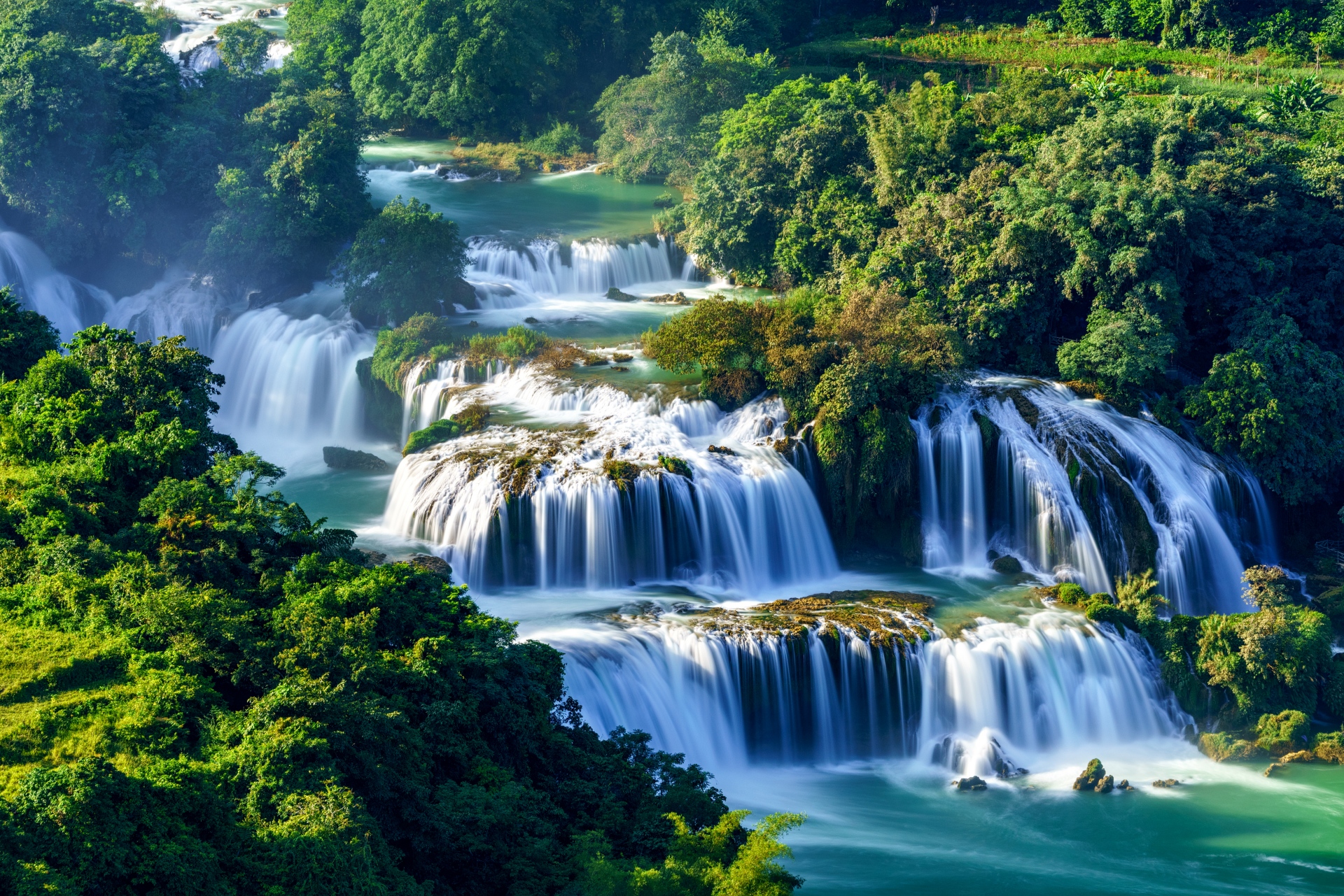 Photographer taking long exposure shots of Ban Gioc Waterfall in northern Vietnam’s Cao Bang province.