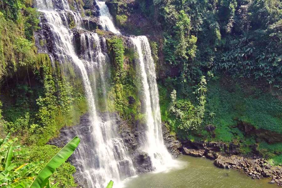 Tad Yuang waterfall on the Bolaven Plateau — a peaceful retreat for eco-tourism and spiritual travel in Laos.