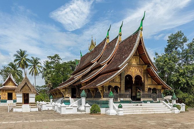 Daytime view of Wat Xieng Thong in Luang Prabang — a spiritual highlight for those who travel in Laos.