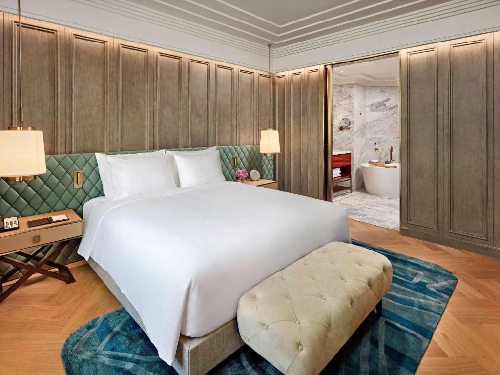Spacious deluxe bedroom with luxury design at mövenpick hotel hanoi