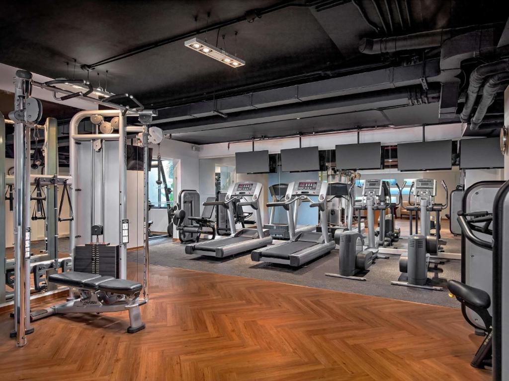 Fully equipped fitness center with modern gym machines at mövenpick hotel hanoi