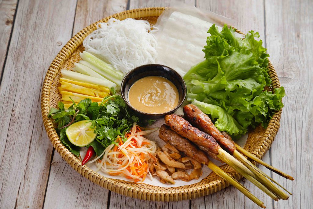 Vietnam night market delight - Grilled nem lụi (lemongrass pork skewers)