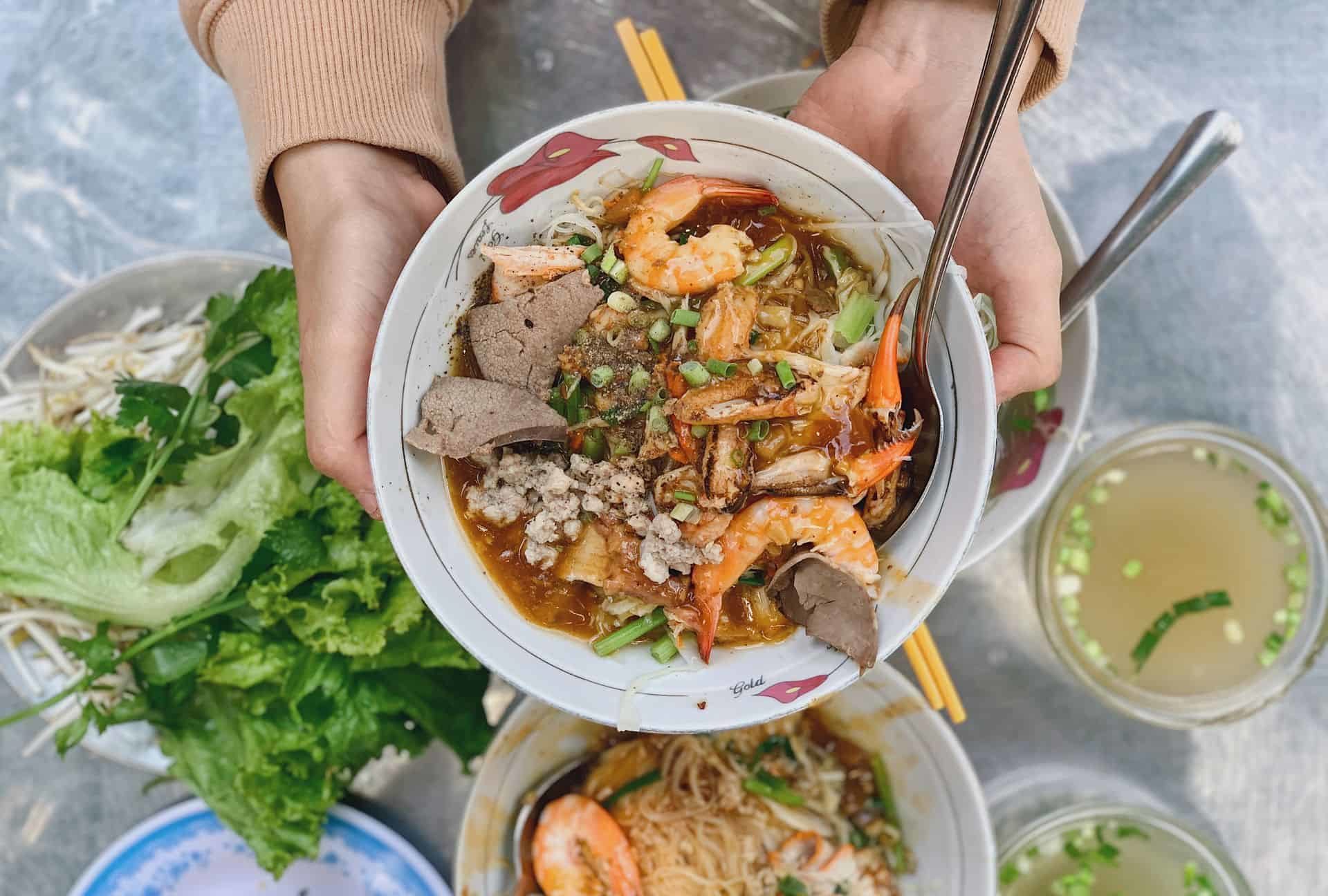 Vietnam night market delight - Steaming bowls of Sài Gòn-style hủ tiếu (noodle soup)