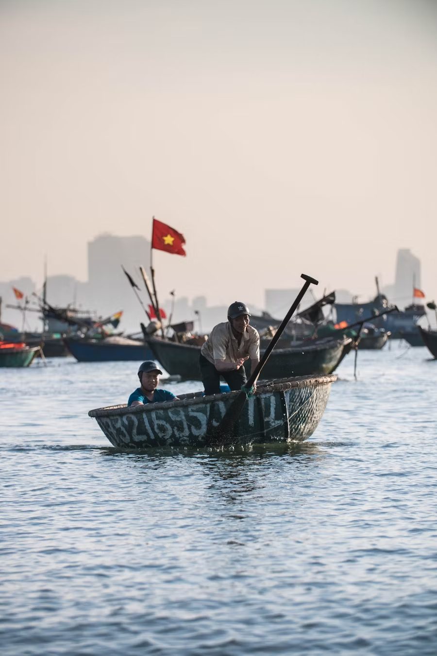 Fishing boat on a serene Vietnamese river - a peaceful charm of Vietnam's coastal tourism destinations