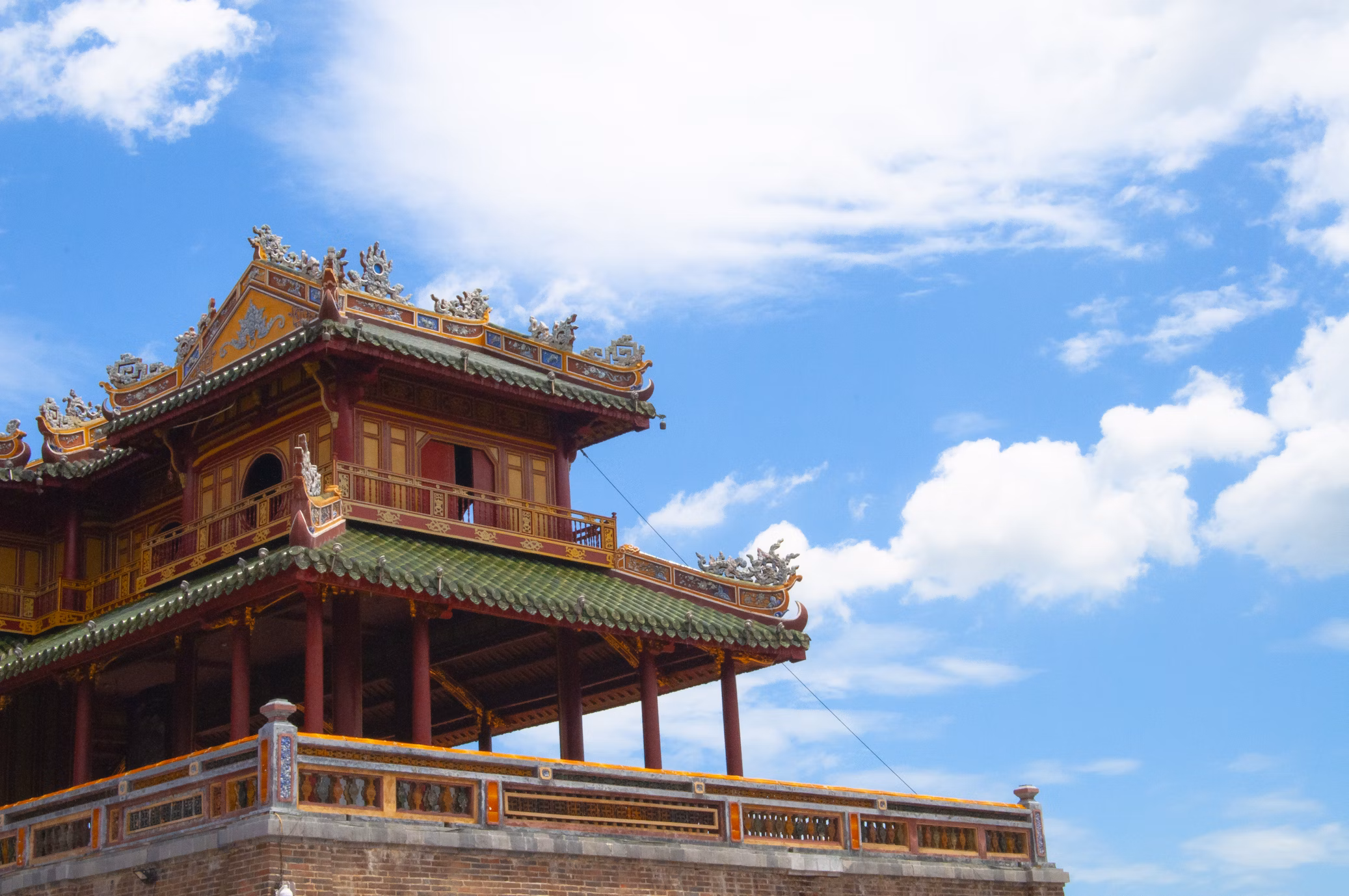 Imperial architecture of the Citadel in Hue under a bright blue sky—reflecting Vietnam’s royal heritage and cultural depth in every traveler’s experience.