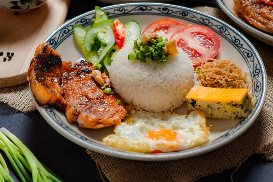 Hanoi to Saigon com tam: Vietnamese broken rice with grilled pork, egg, and pickled veggies