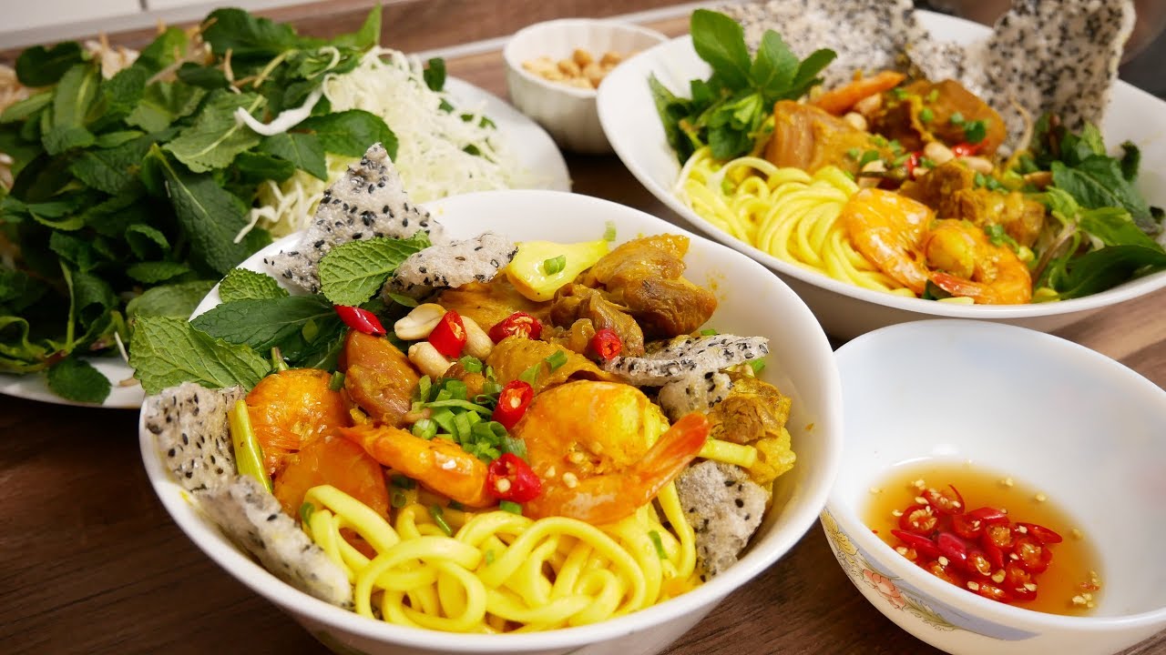 Hanoi to Saigon Mi Quang: Central Vietnamese turmeric noodles with shrimp, pork, and crunchy rice crackers