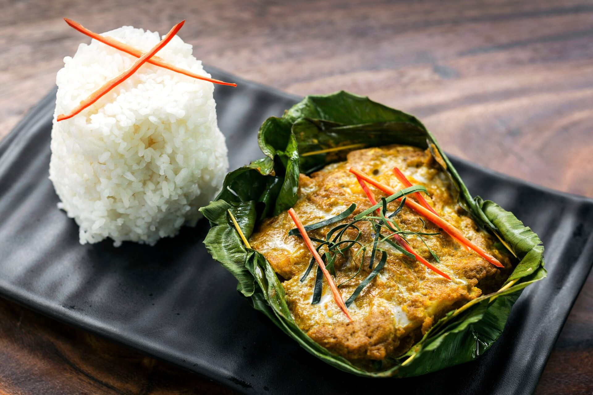 Amok Trey - Steamed fish amok, a classic Cambodian cuisine, served in a banana leaf.