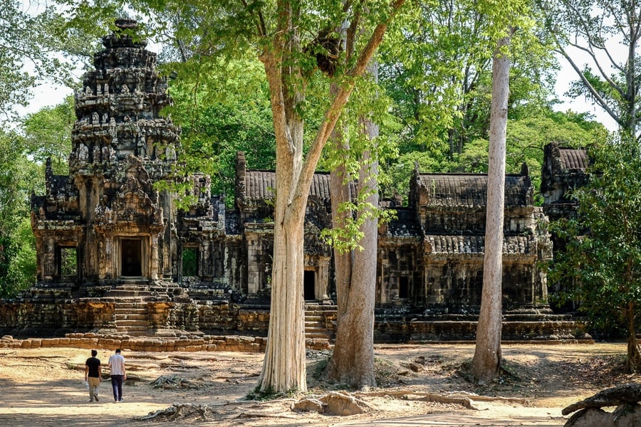 Travel to Angkor Wat to explore intricate stone carvings and ancient bas-reliefs within the iconic Cambodian temple complex