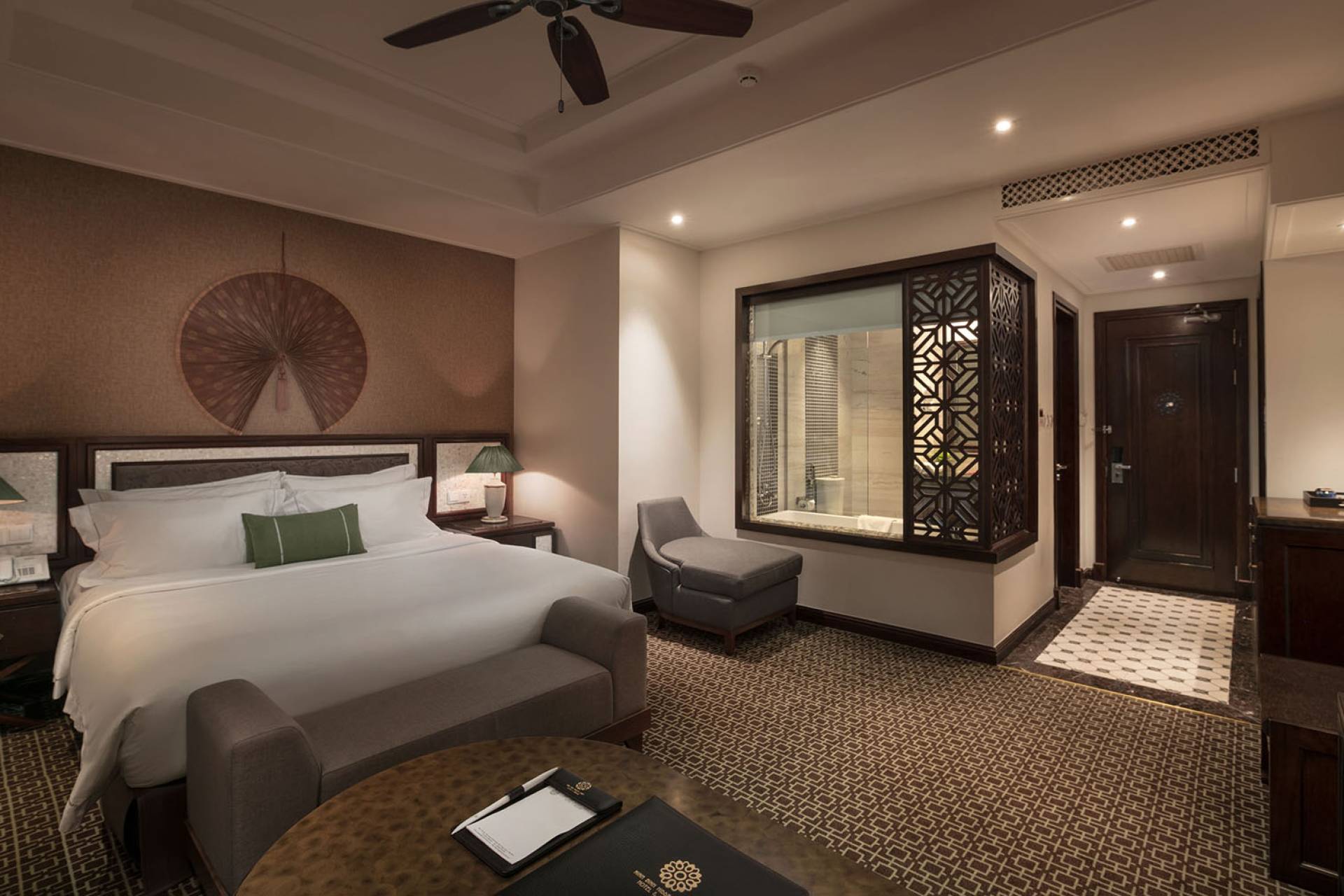 Luxurious room design at Ninh Binh Hidden Charm Hotel & Resort featuring elegant wooden interiors and Vietnamese-inspired architecture.
