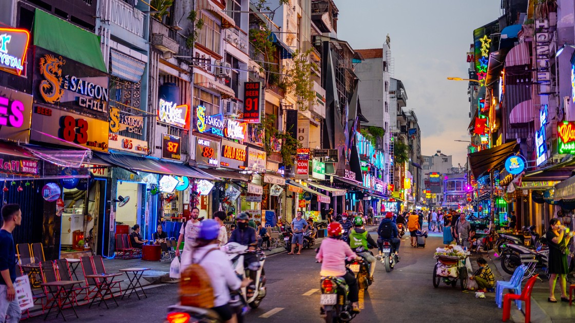 A bustling street in Ho Chi Minh City at dusk, ideal for a trip during the Best Time to Visit Southeast Asia