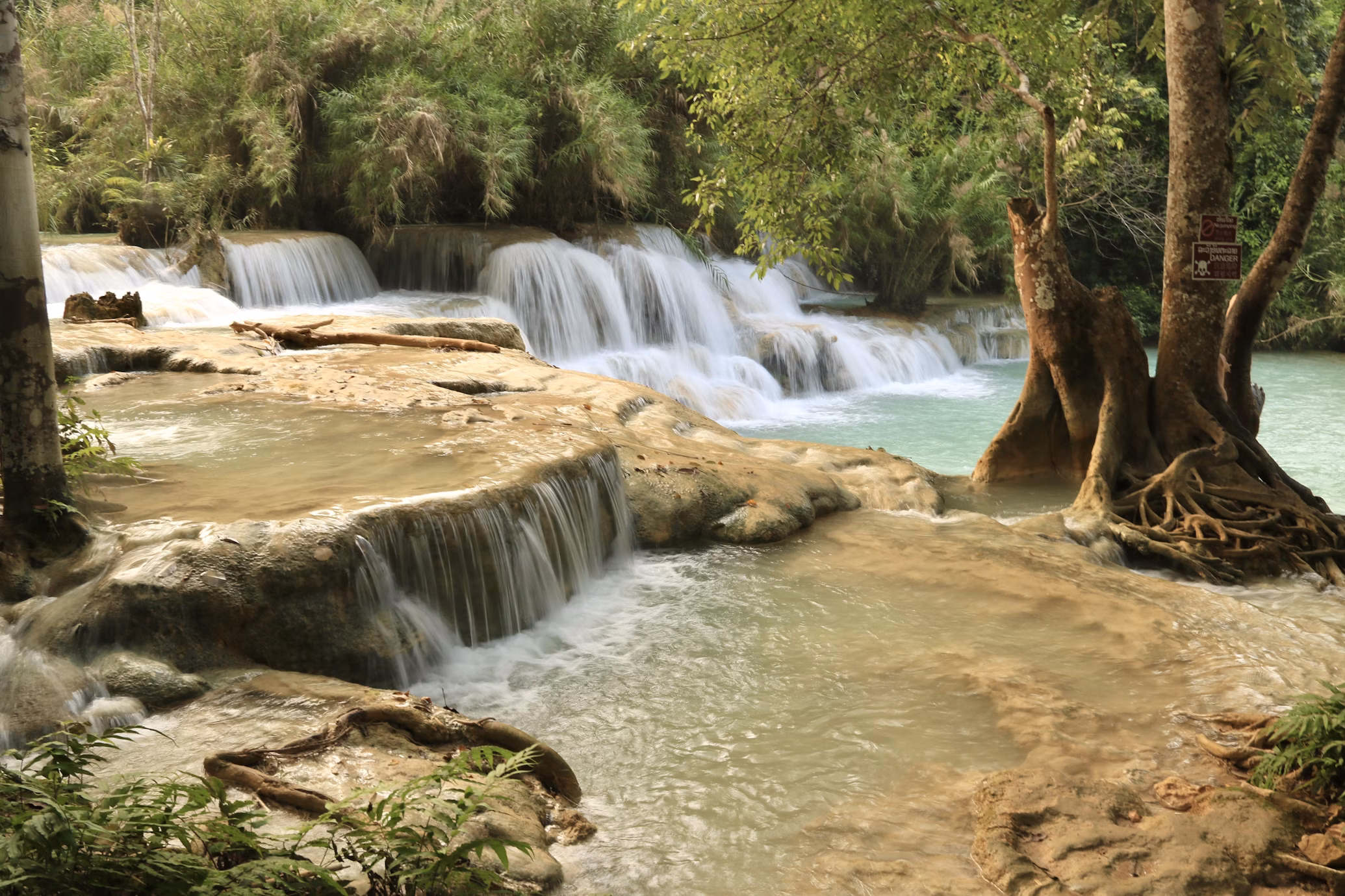 turquoise cascades of Kuang Si Falls