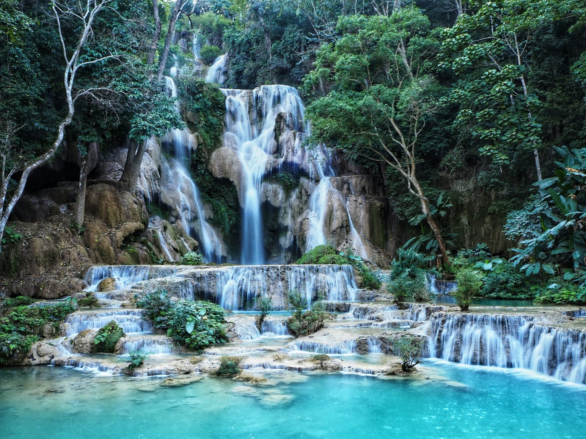 A beautiful, multi-tiered cascade of the Kuang Si Waterfalls in Northern Laos