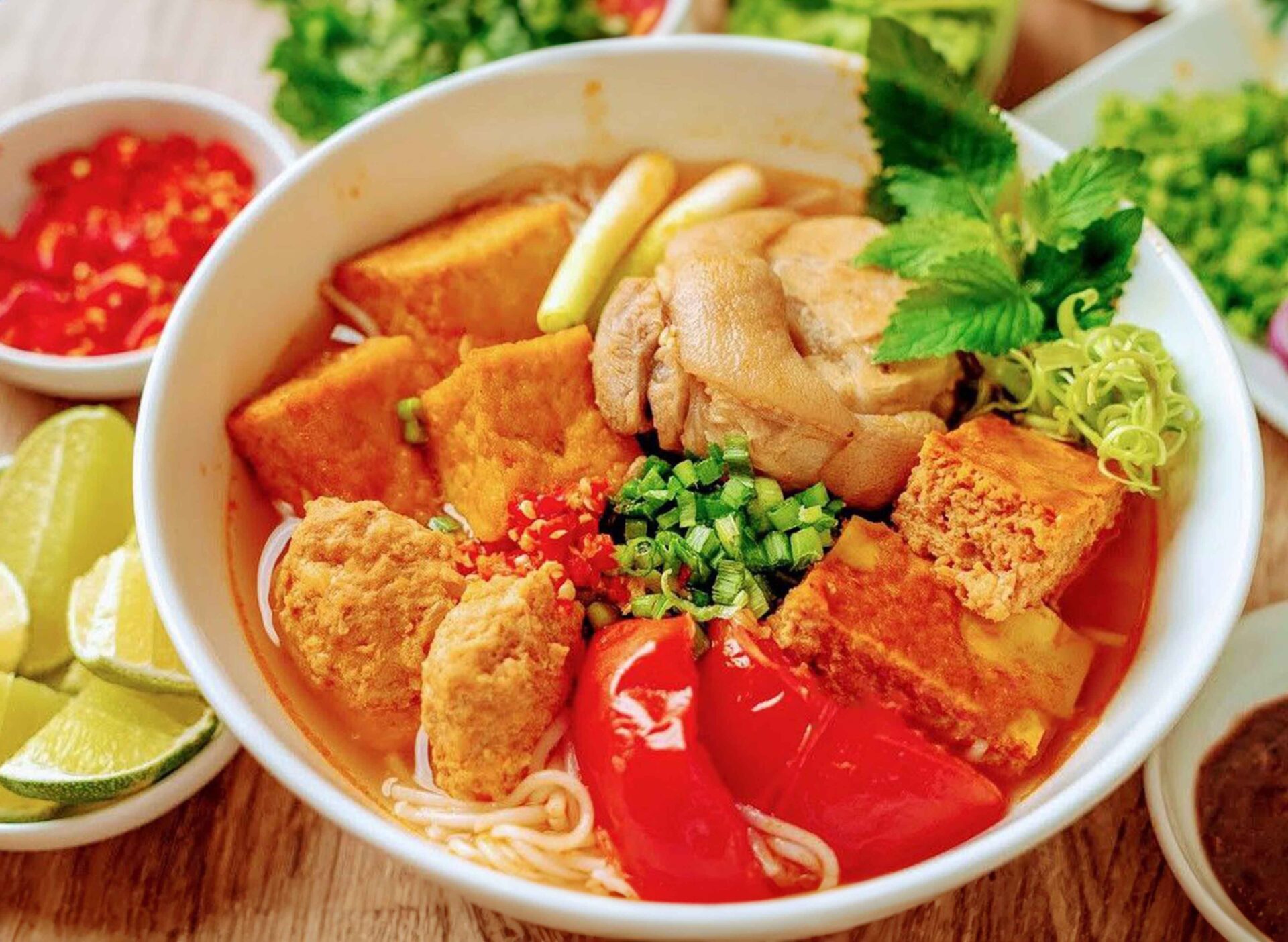 A bowl of Nom Banh Chok, a traditional Khmer noodle dish and staple of Cambodian cuisine