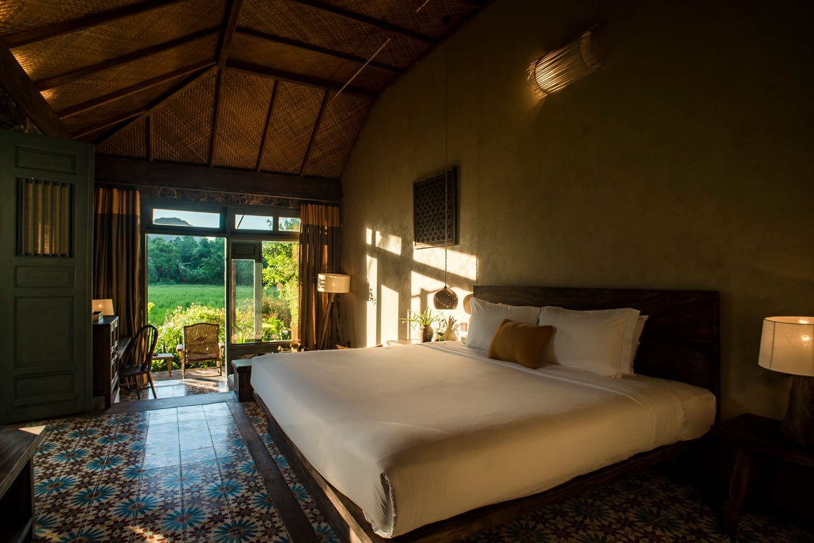 Premium Tonkin Garden Bungalow at Tam Coc Garden Resort with rustic design, garden view, tiled floor, and cozy interior