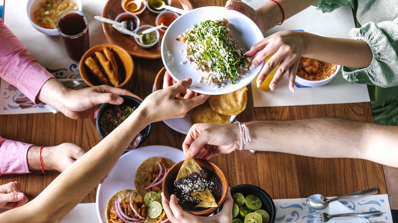 Everyone receive food with their right hand, following Southeast Asia culture dining etiquette