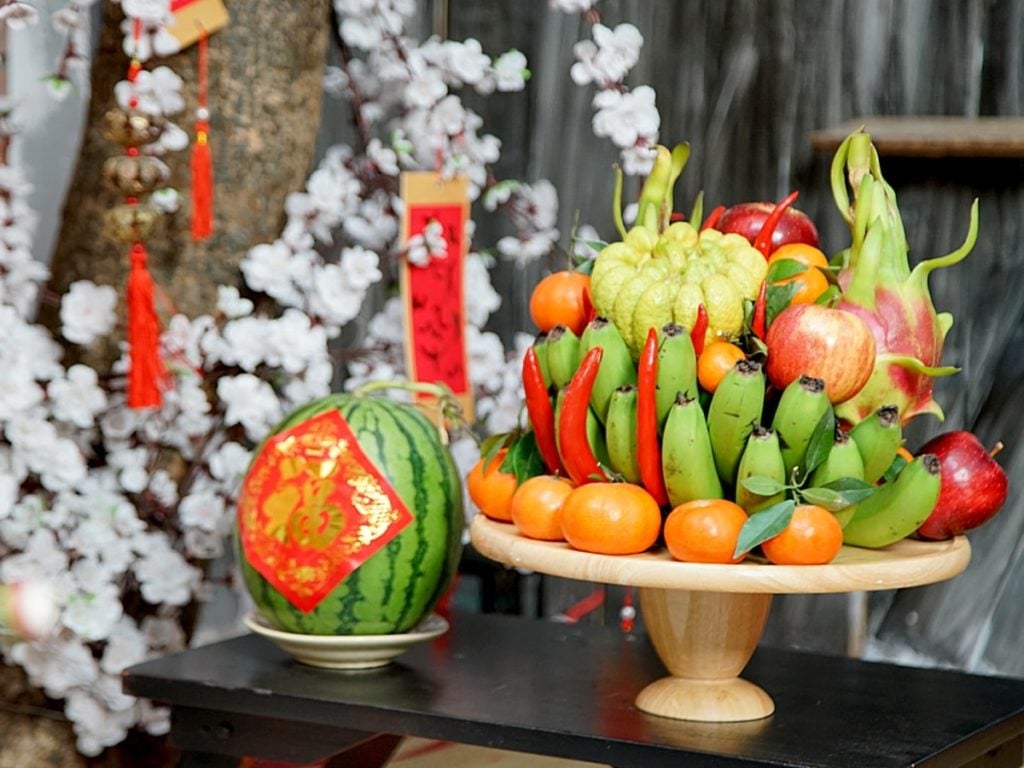Five-fruit tray with watermelon and bananas, a colorful Vietnamese New Year’s Food offering symbolizing luck, prosperity, and happiness.