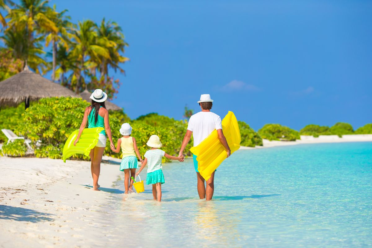 A family enjoys the pool at one of the best beach resorts in Thailand