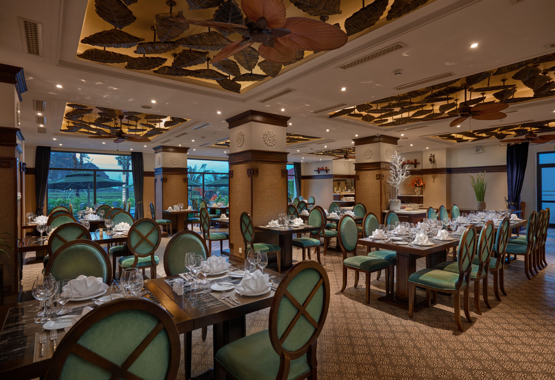 Elegant dining room at Ninh Binh Hidden Charm Hotel & Resort featuring artistic ceiling design and fine-dining atmosphere.