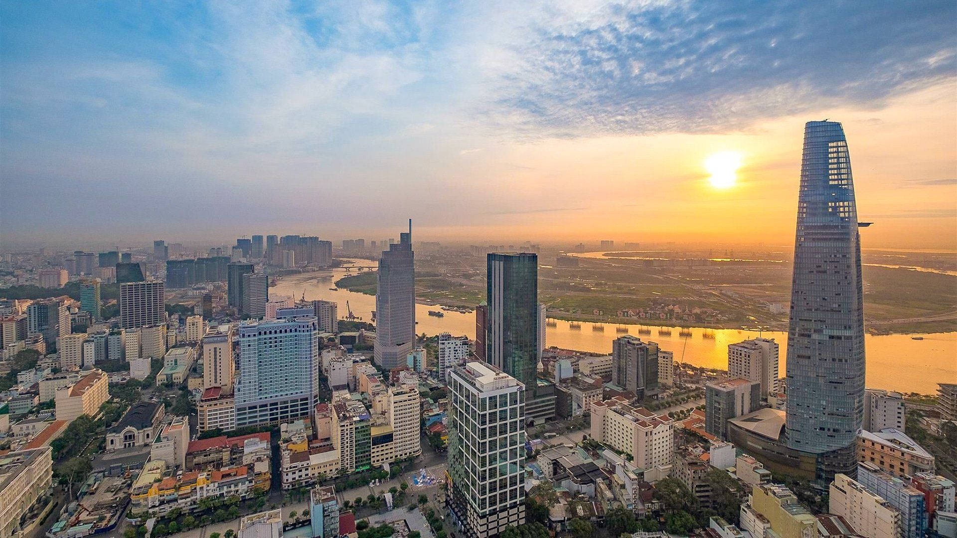 An aerial sunset view of the modern Ho Chi Minh City skyline, showcasing a vibrant cityscape in Vietnam in June