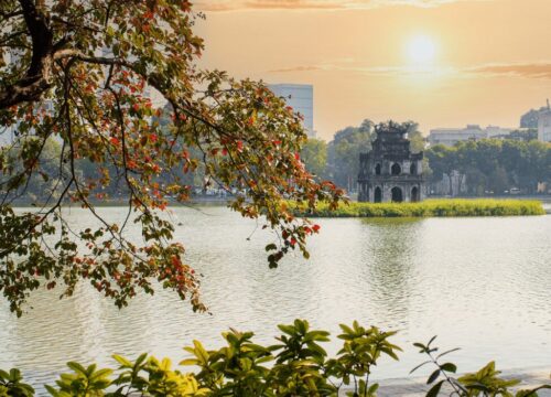 The sun sets over Hoan Kiem Lake in Hanoi, a serene view in Vietnam