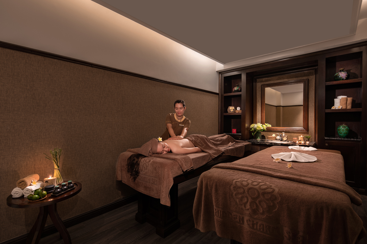 Spa room at Ninh Binh Hidden Charm Hotel & Resort featuring relaxing massage therapy and warm Vietnamese-inspired interior design.