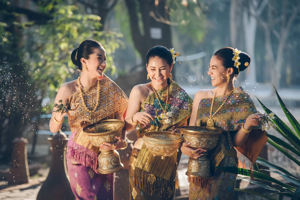 Friendly smiles from Thailand, "the Land of Smiles," a key aspect of Southeast Asia culture.