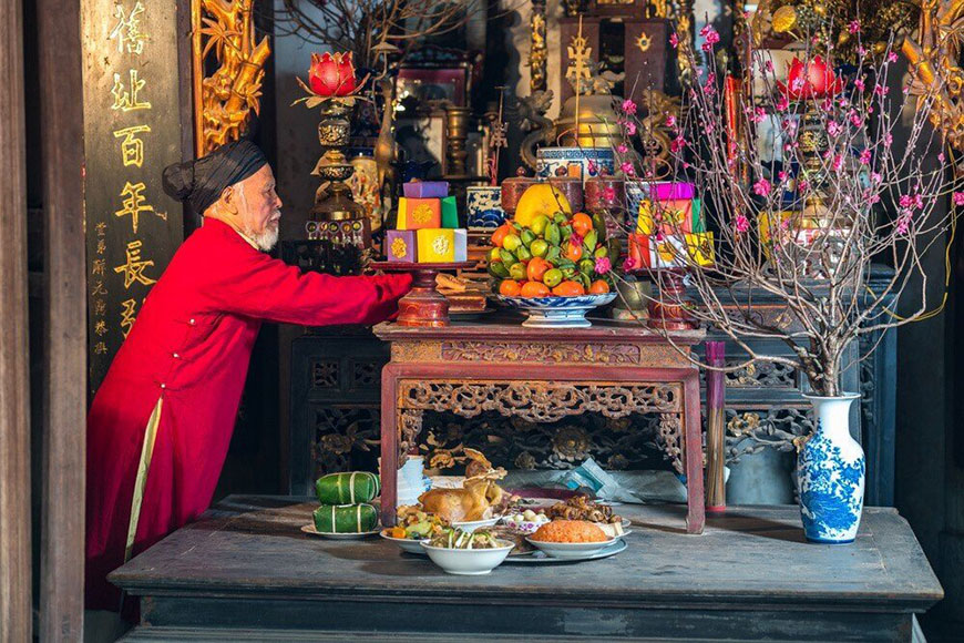 A Vietnamese family gathers for an ancestor worship ritual, illustrating the strong emphasis on family in Southeast Asia culture
