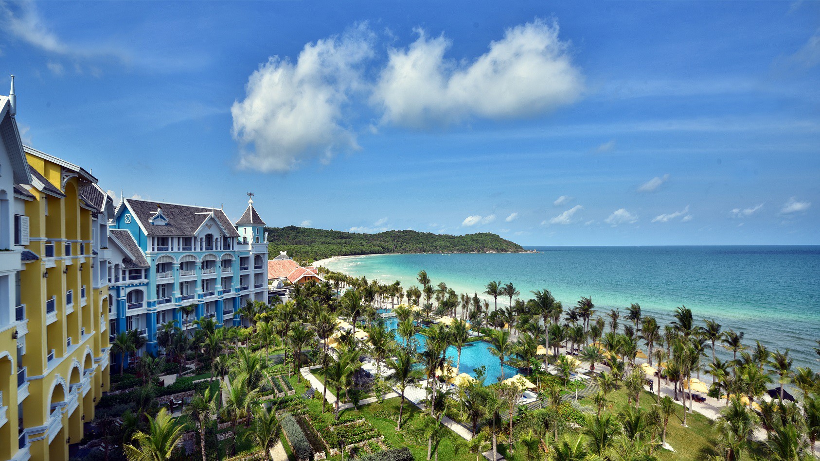 An expansive view of the stunning JW Marriott Phu Quoc Emerald Bay resort, perfect for phu quoc island holiday packages