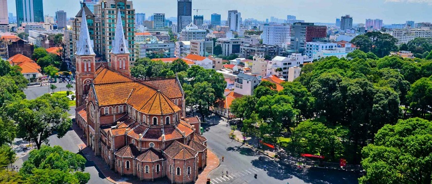An aerial view shows the Notre Dame Cathedral Basilica of Saigon, highlighting the best time to visit Ho Chi Minh City for clear views