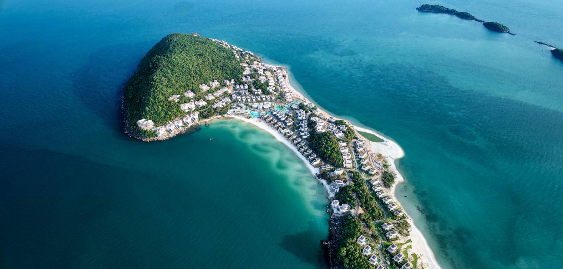 An aerial view of the luxurious Premier Village Phu Quoc Resort nestled on a peninsula, offering exclusive phu quoc island holiday packages