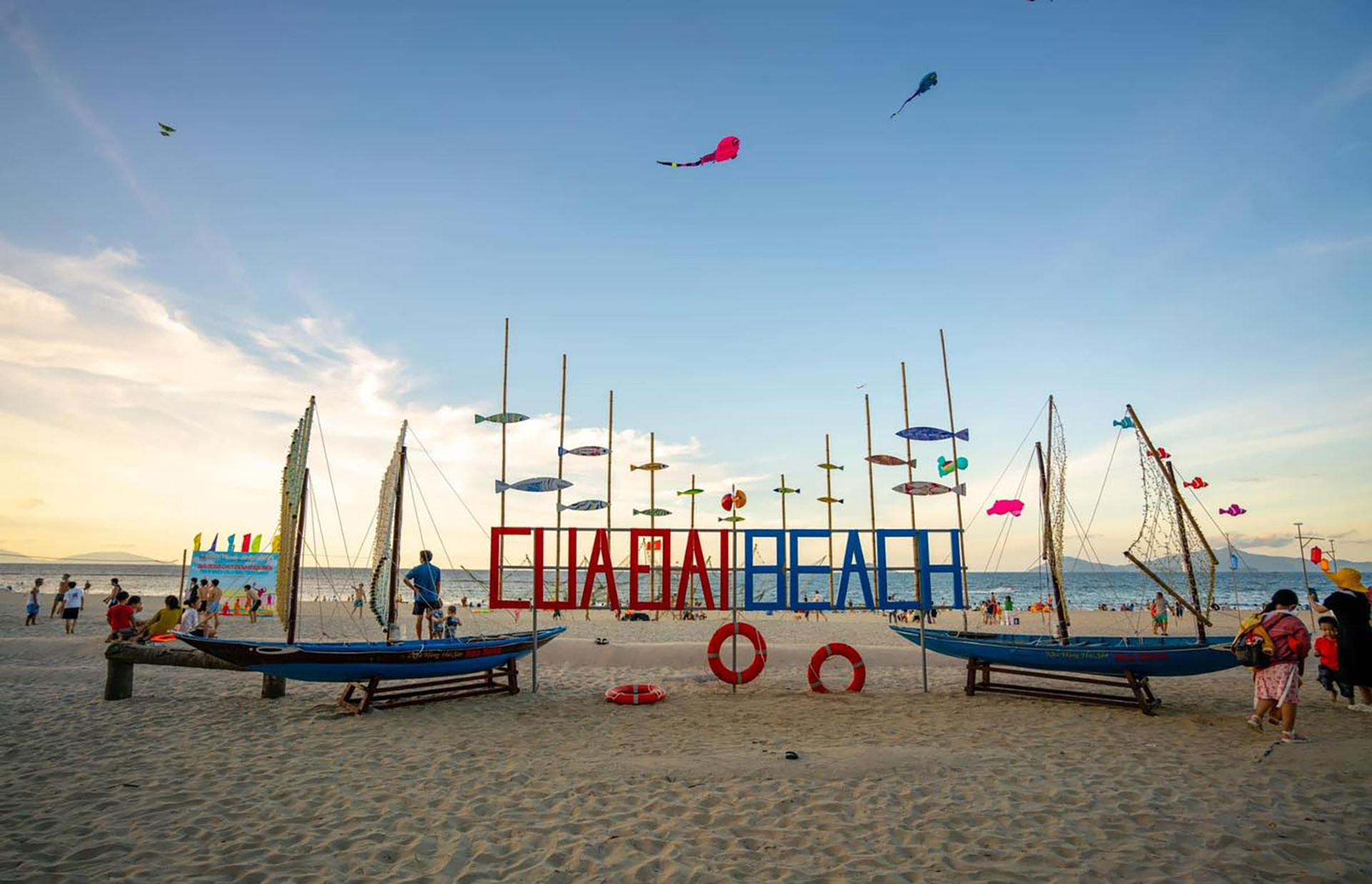 The colorful 'Cua Dai Beach' sign, a beautiful stop on a hoi an private tour