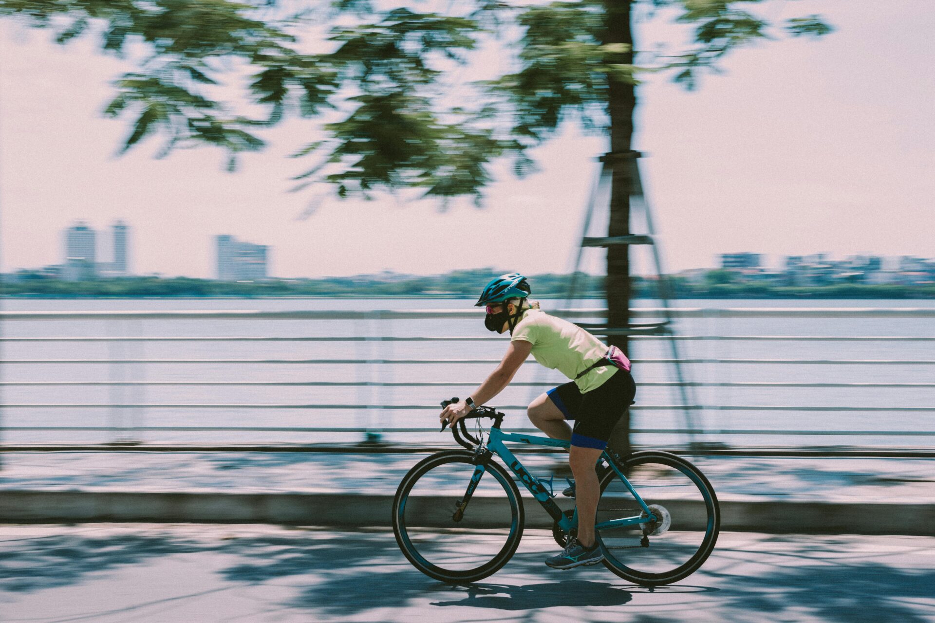 Cycling along the road beside West Lake Hanoi