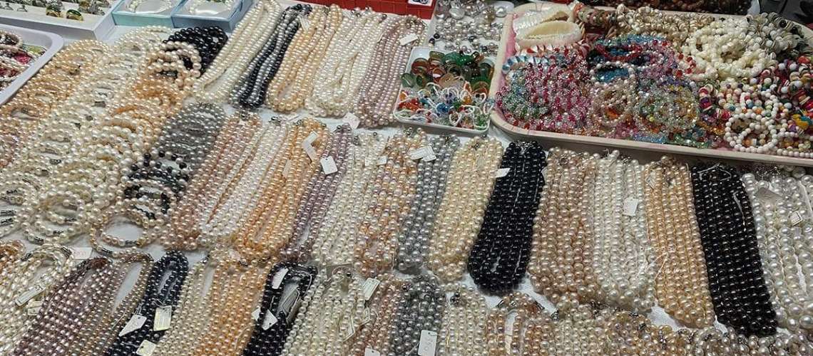 Vendor's table at the Phu Quoc night market, specializing in Pearl Jewelry & Souvenirs