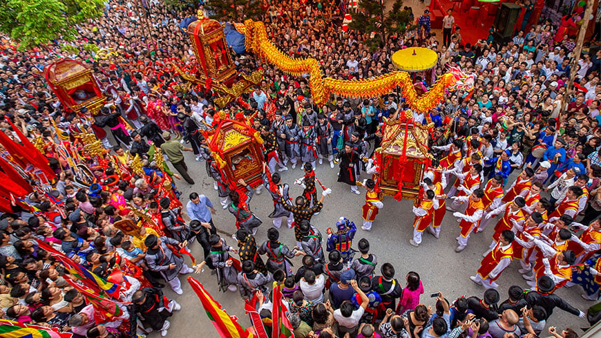A dense crowd watches a traditional festivals in Vietnam