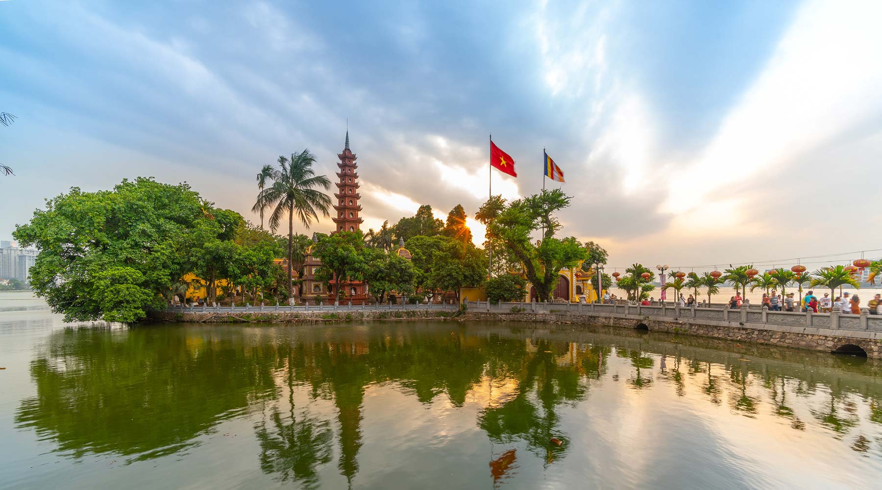 Tran Quoc Pagoda, with its reflection in the water of West Lake Hanoi at sunset