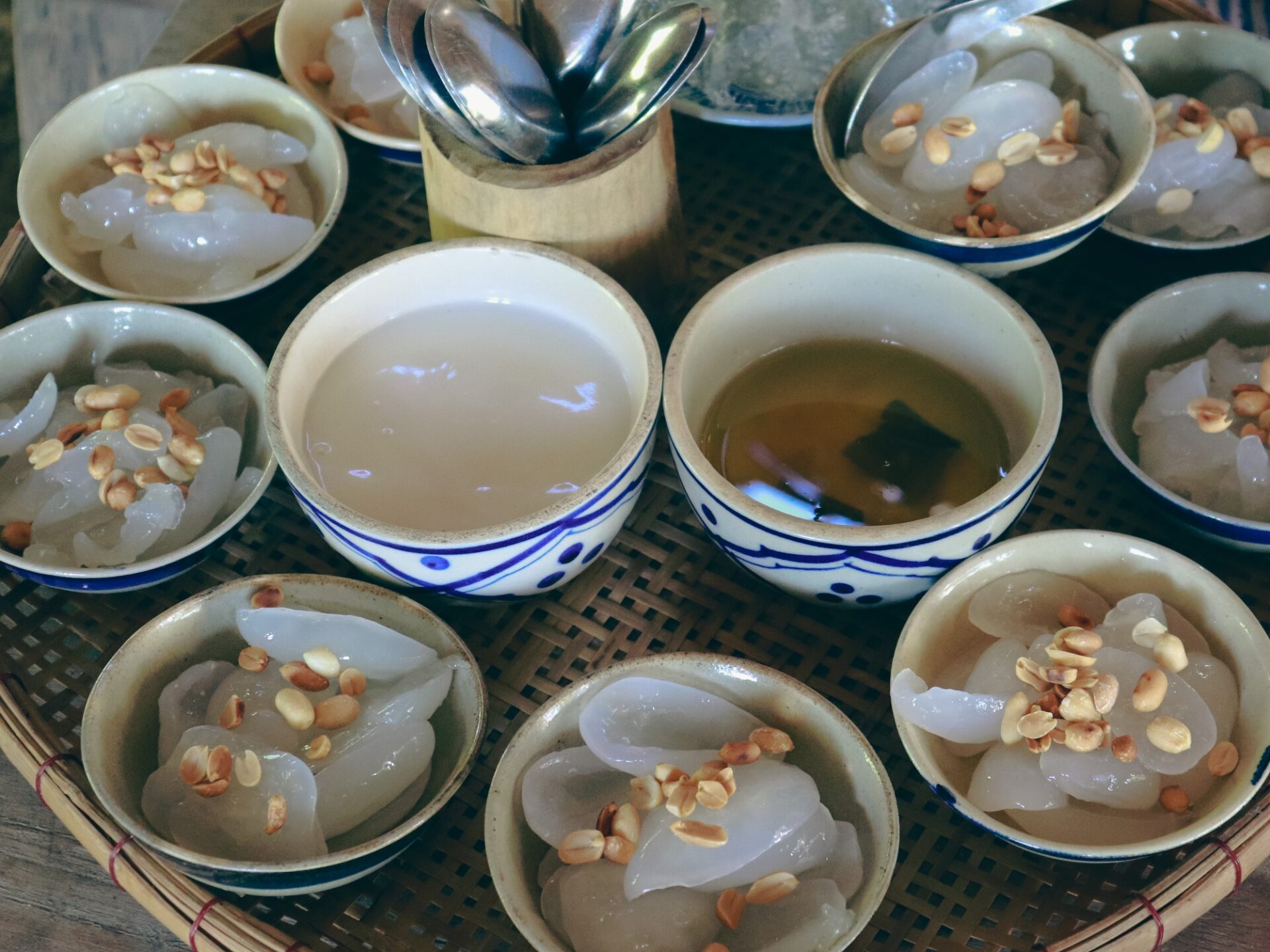 Traditional chè dừa nước Hội An served in small bowls enjoyed by visitors exploring Bay Mau Coconut Forest.