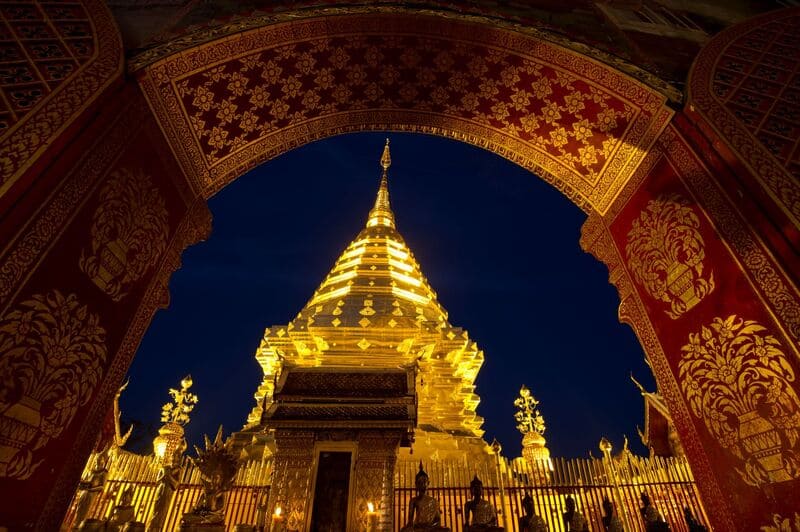 The magnificent golden stupa of Wat Phra That Doi Suthep, capturing the serene side of chiang mai nightlife