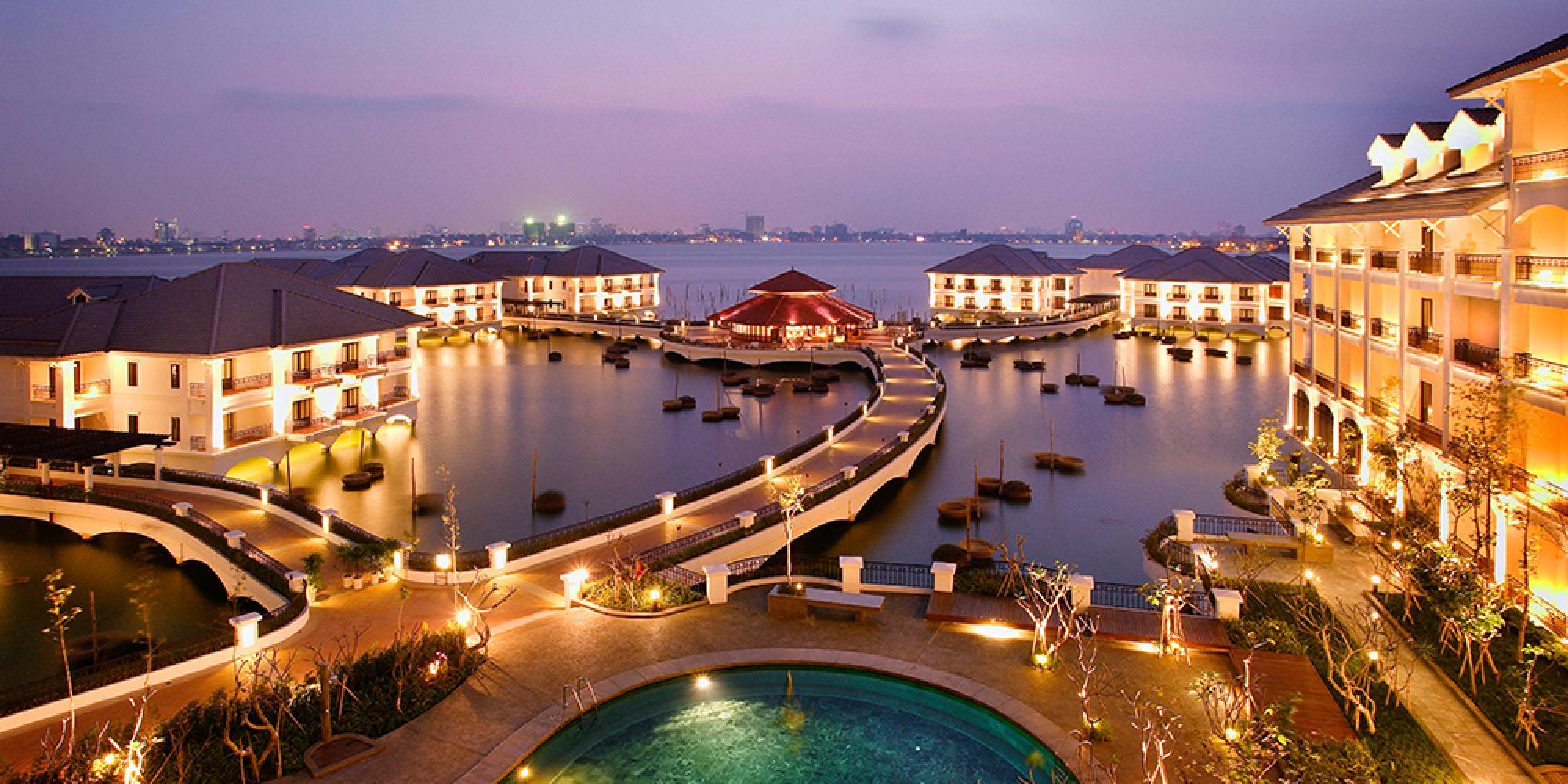 An aerial view of the red-tiled Tran Quoc Pagoda on an islet in West Lake, a featured stop on hanoi day tours.