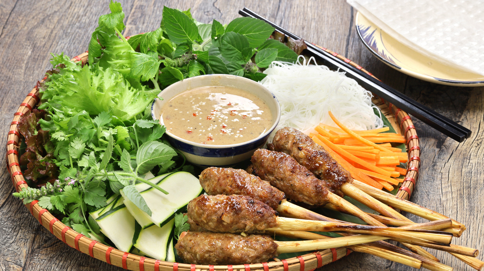 A bamboo tray of Nem Lui, a delicious roll-it-yourself meal on "hanoi day tours"
