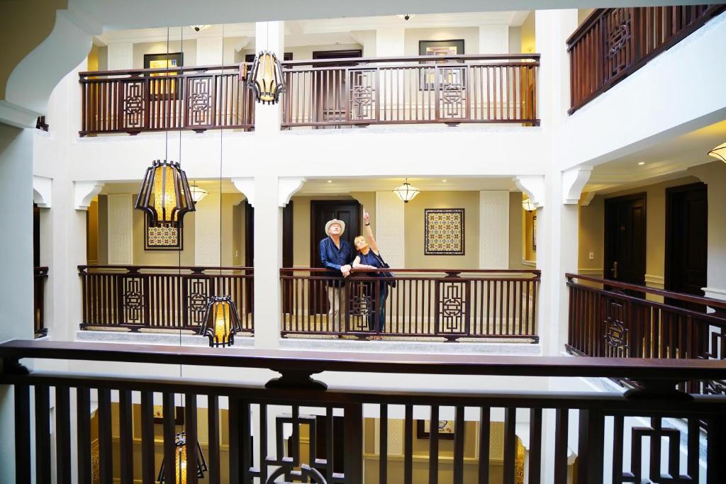 Allegro Hoi An interior courtyard with balconies reflecting Hoi An