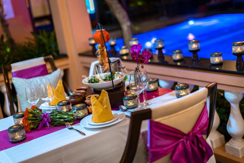 Allegro Hoi An romantic poolside dinner setup at night experience