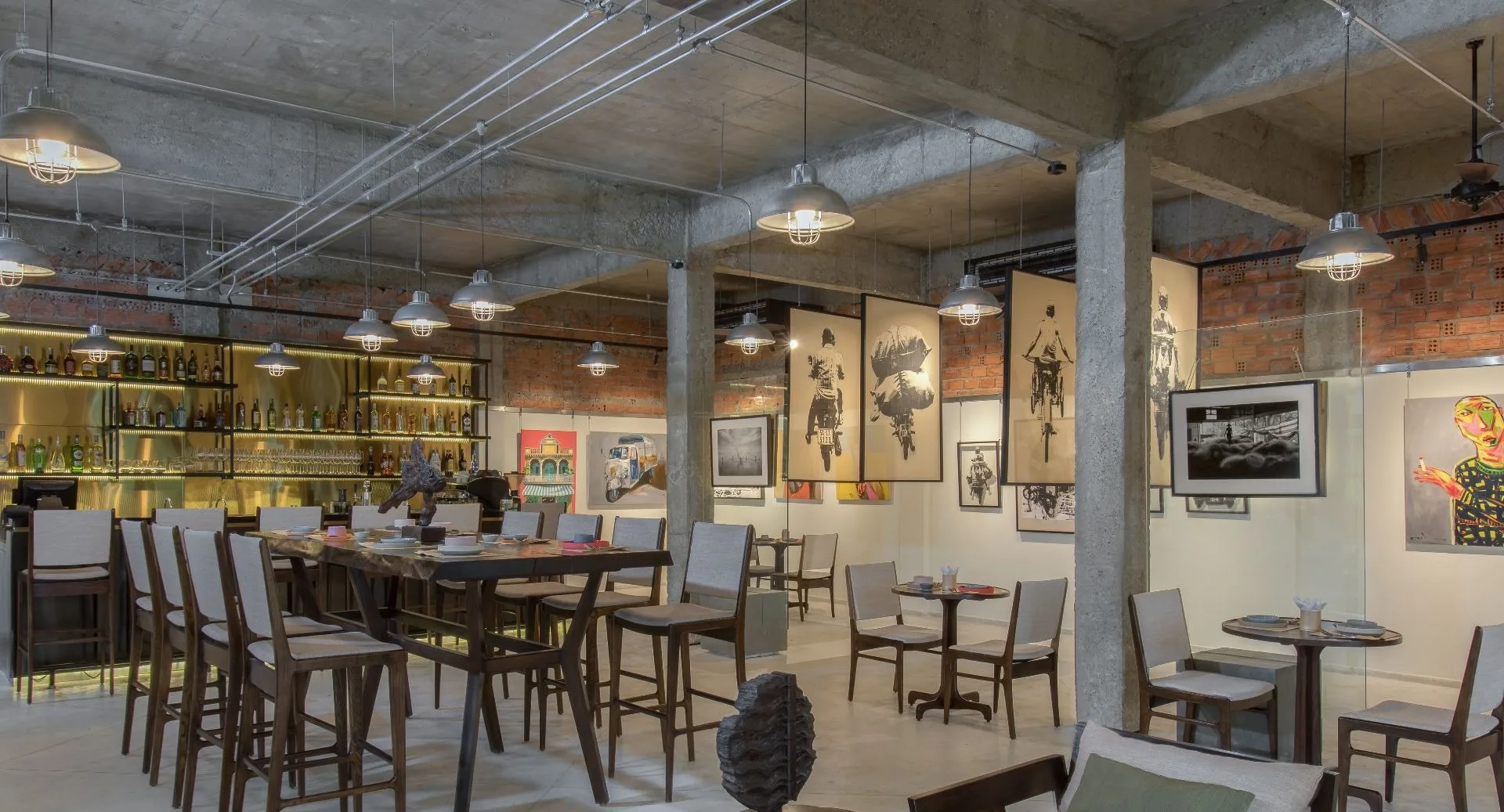 Art Space restaurant and bar featuring modern Vietnamese artwork and industrial design at Anantara Hoi An Resort.