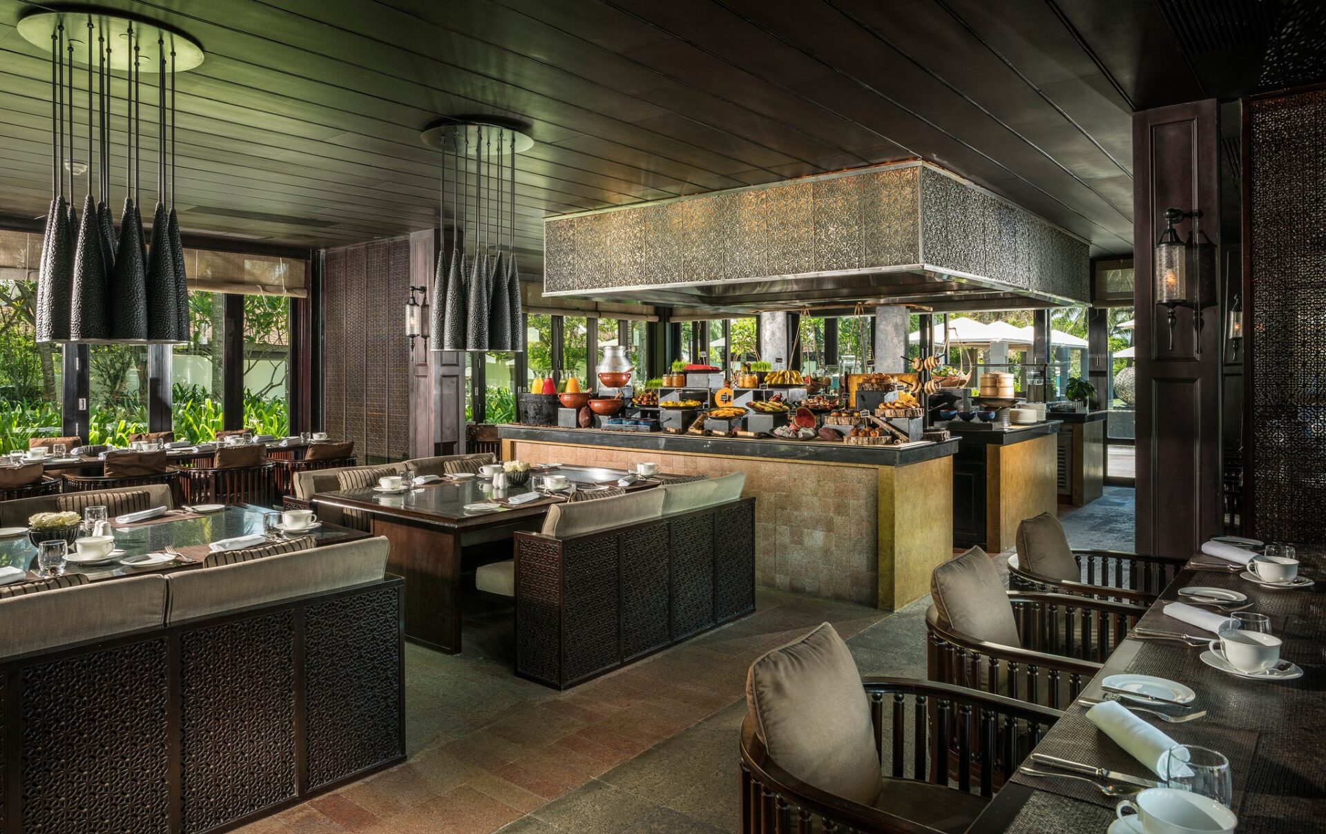 Luxurious buffet breakfast setup at Four Seasons Resort The Nam Hai, featuring Vietnamese and international cuisine.
