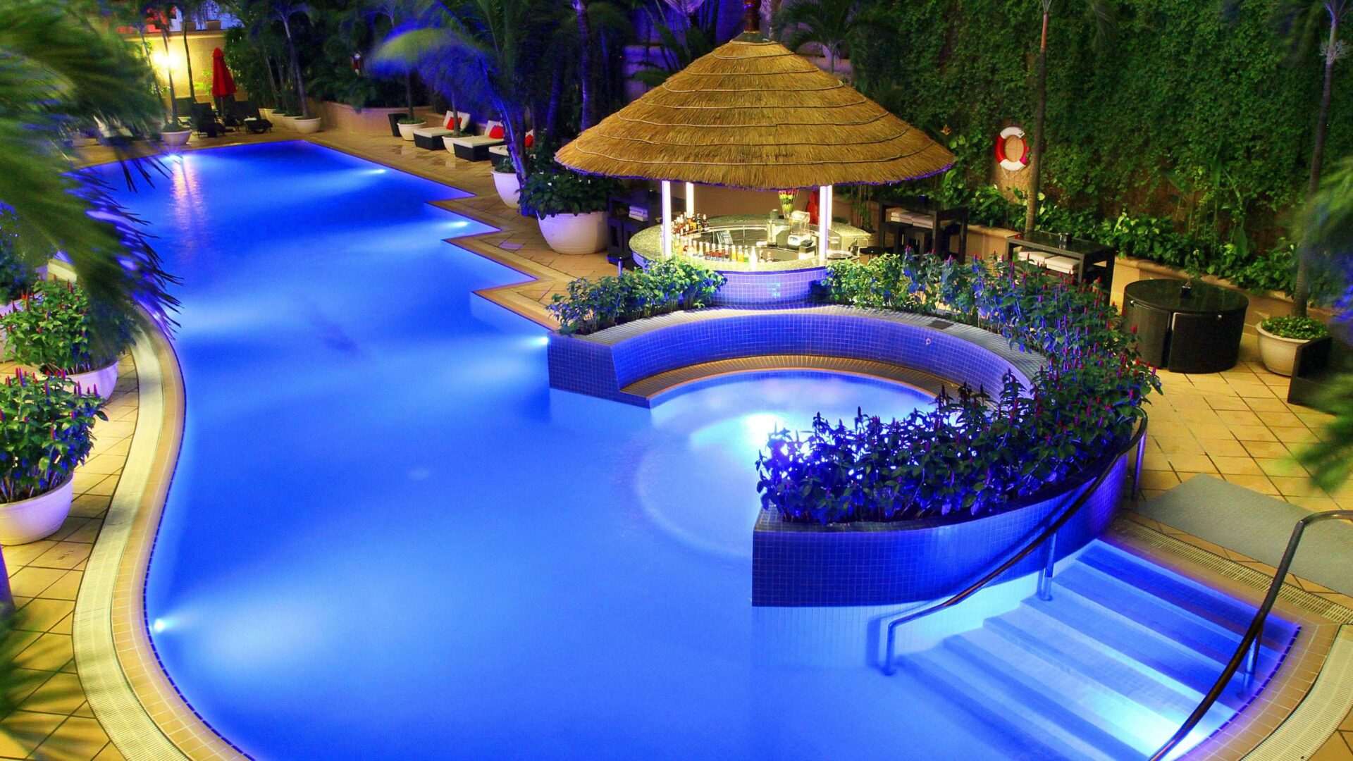 a stunning outdoor swimming pool in Caravelle Saigon Hotel