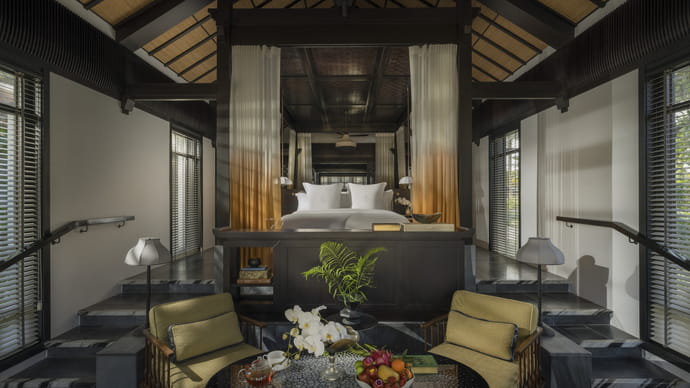 Elegant villa bedroom with canopy bed at Four Seasons Resort The Nam Hai, Vietnam.