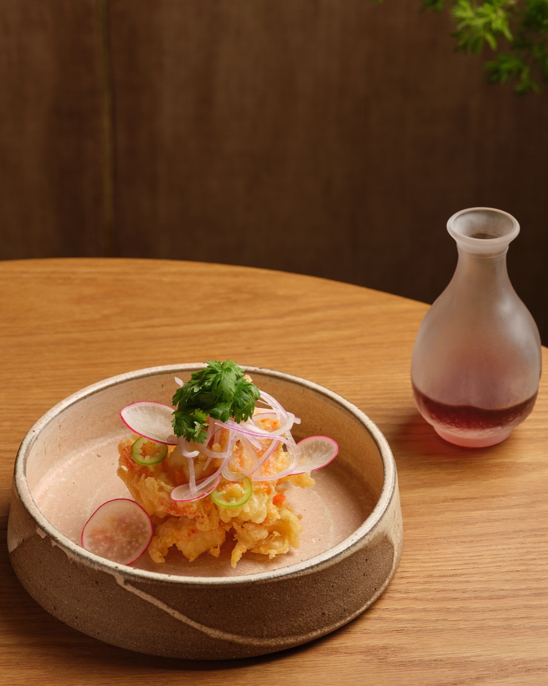 Gourmet dish with tempura and herbs served at Four Seasons Resort The Nam Hai, Vietnam restaurant.