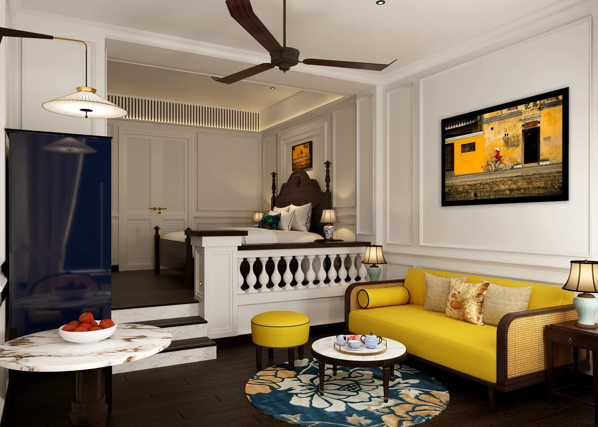 Colonial-inspired room featuring yellow sofa, local artwork, and carved bed at Anantara Hoi An Resort.